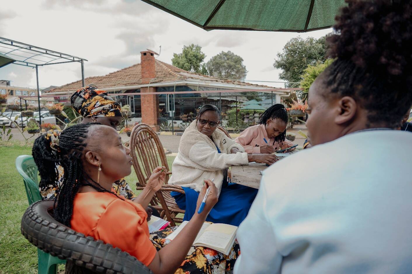 Selina actively contributes to a group discussion during a training session. Photo by: Nathaniel Abadji / Opportunity EduFinance